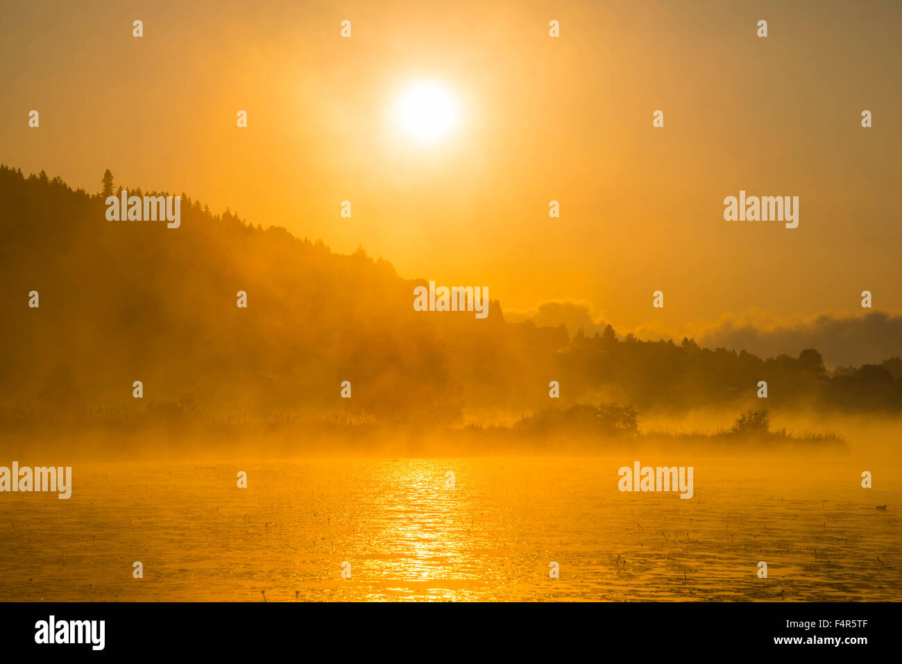 Sunrise, Hopfensee, Füssen Ostallgäu, Algovia, Superiore Svevo, Svevi, Baviera, Germania, Europa, lago, arancione Foto Stock