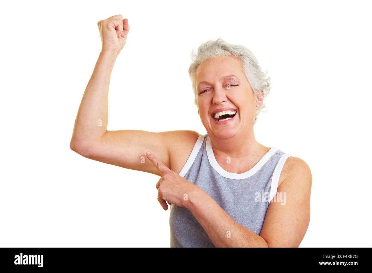 Felice senior donna mostrando il suo braccio superiore muscoli Foto Stock Felice senior donna mostrando il suo braccio superiore muscoli Foto Stock