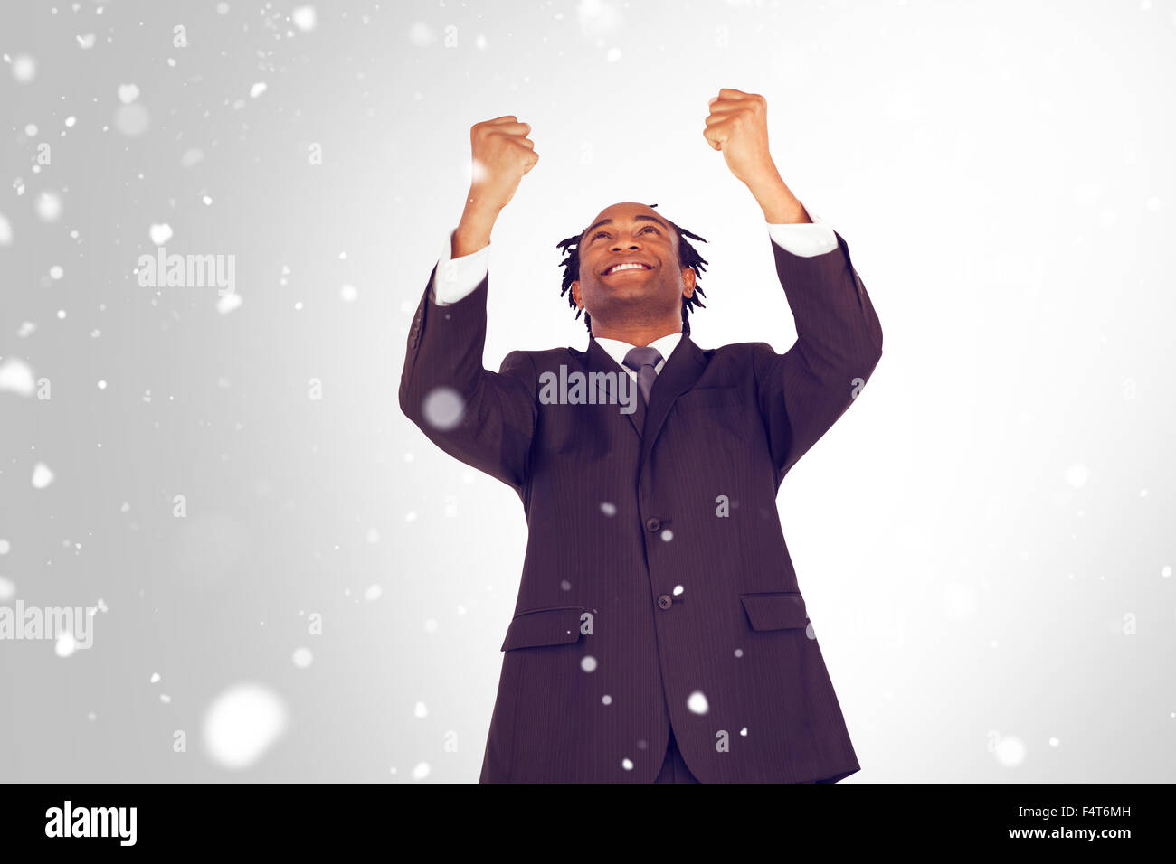 Immagine composita di happy businessman con bracci sollevati Foto Stock