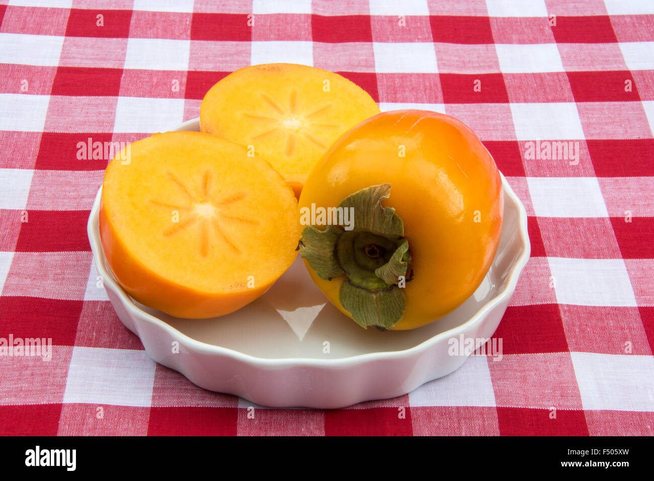 Persimmon frutta tagliata a metà Foto Stock