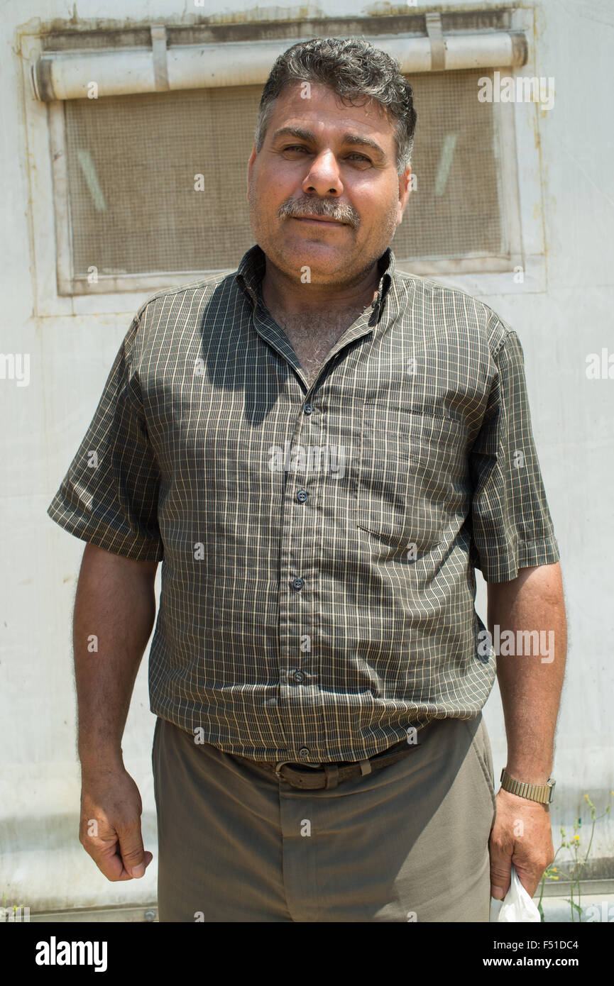 Rifugiato siriano nel centro UNCHR a Tripoli in attesa di registrazione e le cure. Tripoli, Libano 2015 Foto Stock