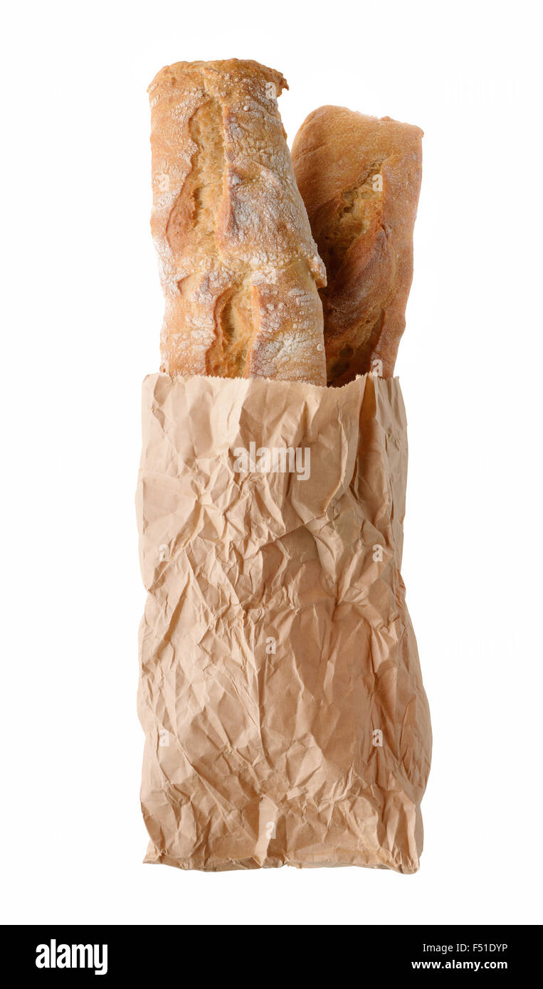 Il cibo fresco rustico pane di frumento in sacchetto di carta, isolato su sfondo bianco Foto Stock