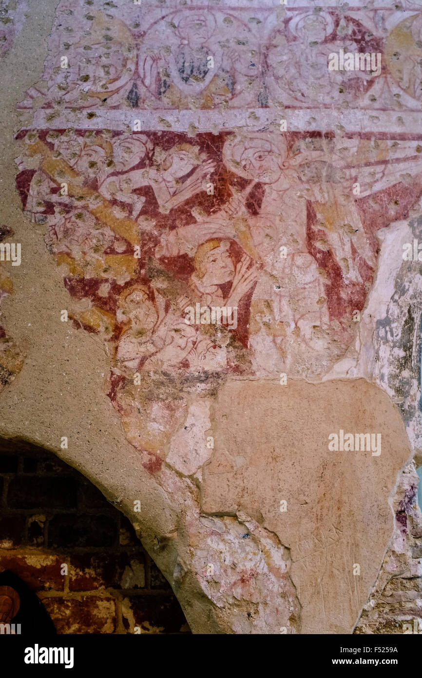 Xi secolo muro romanico dipinti a Santa Maria la Chiesa Parrocchiale, Houghton sulla collina, Norfolk, Regno Unito Foto Stock