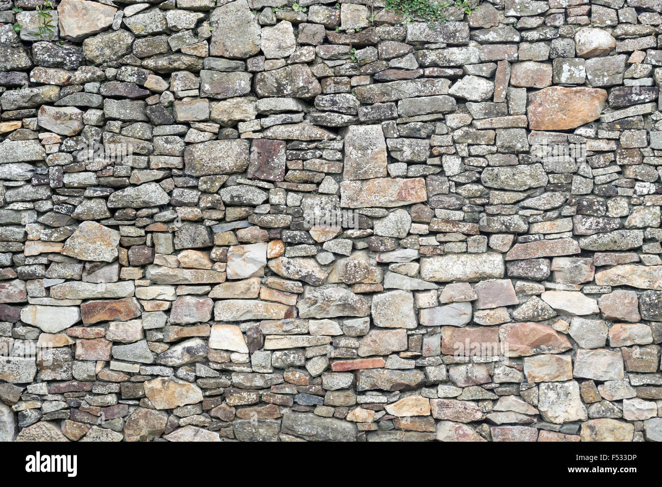 La texture della vecchia weathered medievale muro a secco Foto Stock