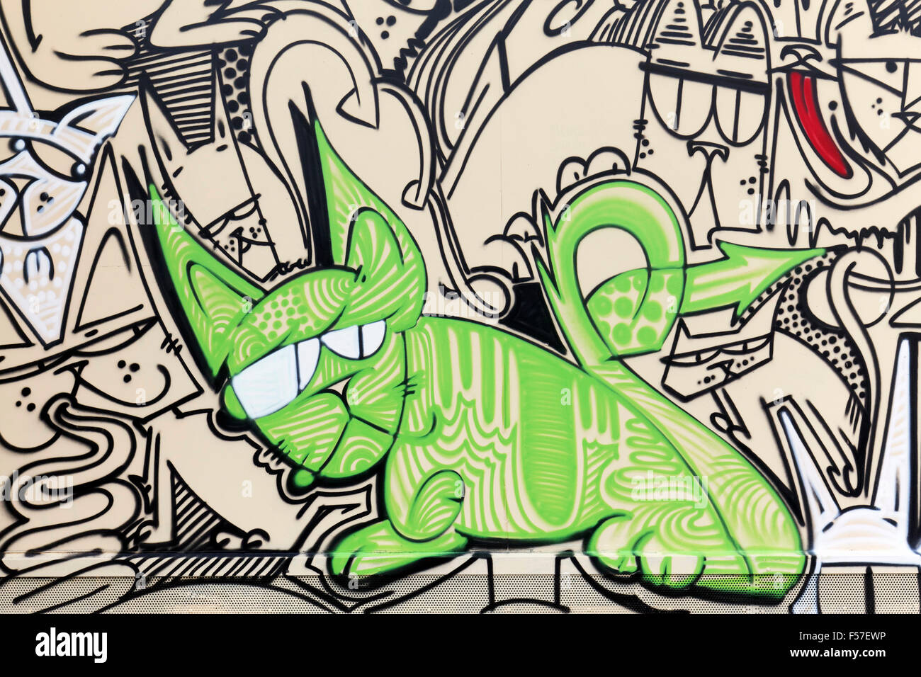 Gatto verde con faccia scorbutico, graffiti street art, Arte Urbana, Dusseldorf, Renania settentrionale-Vestfalia, Germania Foto Stock