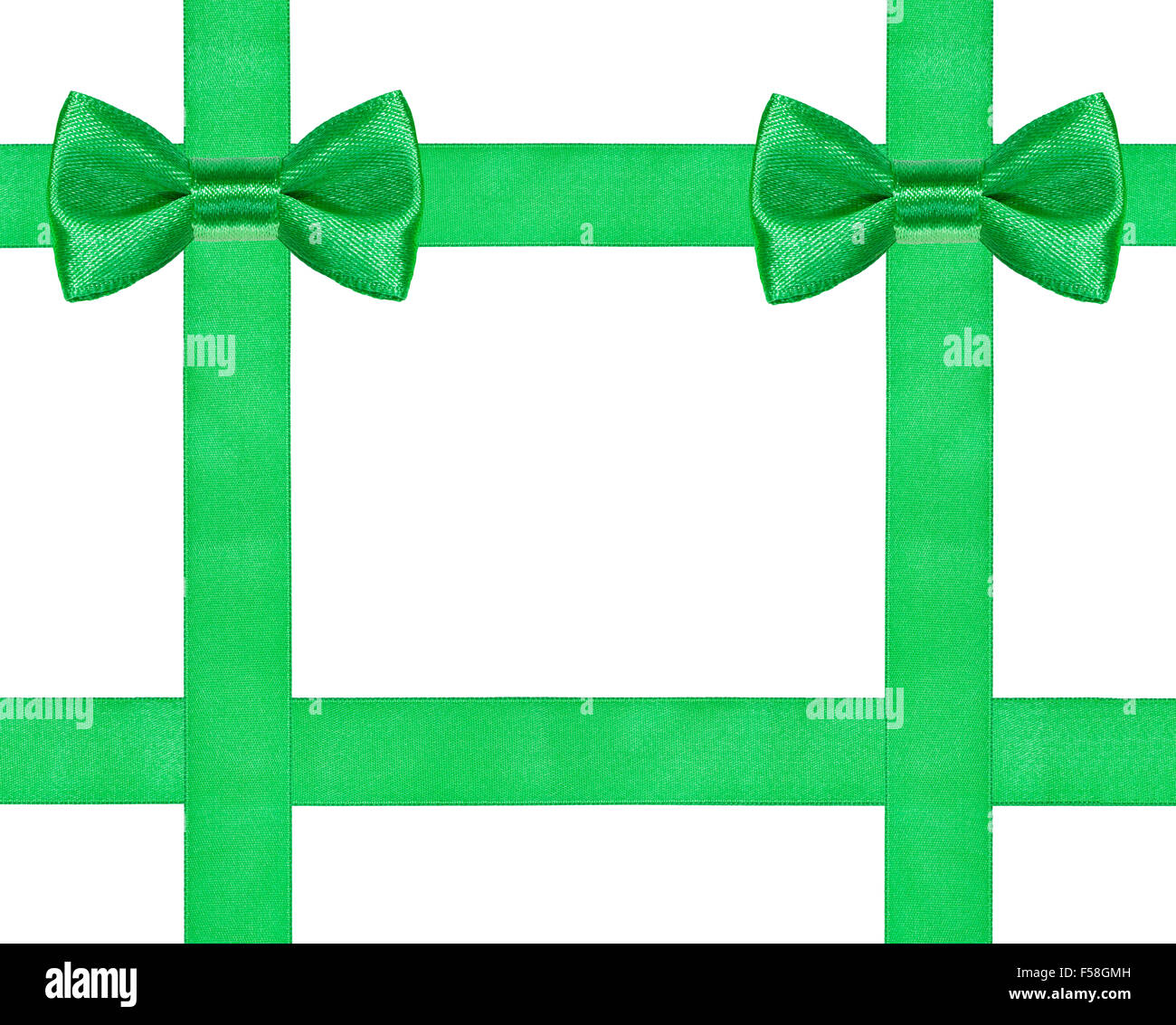 Due grandi verde nodi di prua su quattro nastri di raso isolati su sfondo bianco Foto Stock