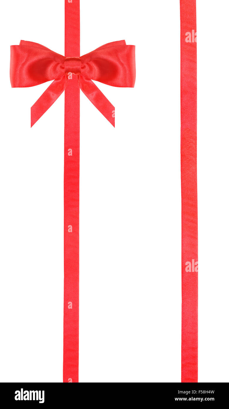 Uno rosso in satin nell angolo in alto a sinistra e due nastri verticali isolati verticali su sfondo bianco Foto Stock