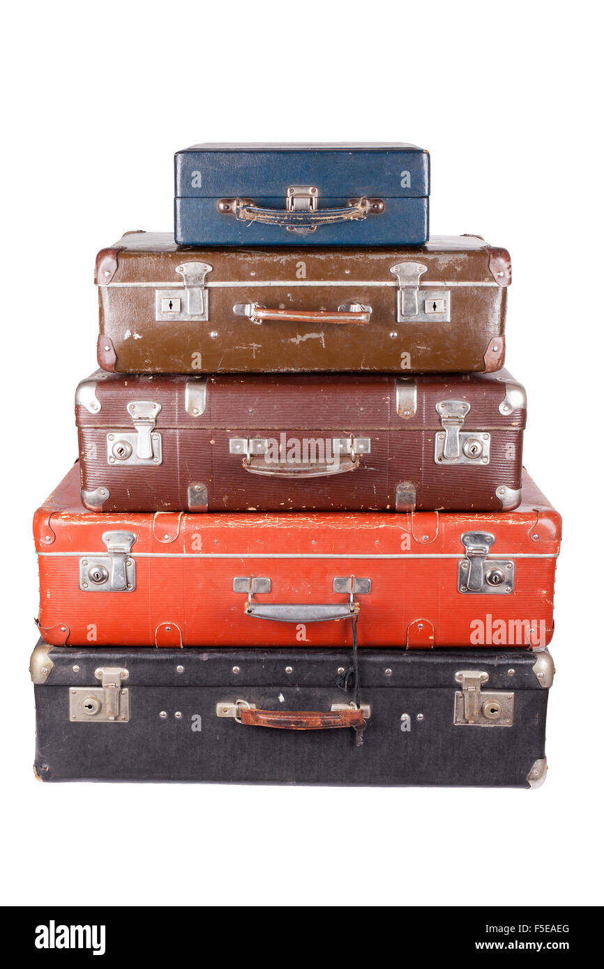 Una pila di vecchi valigie isolato su uno sfondo bianco Foto Stock