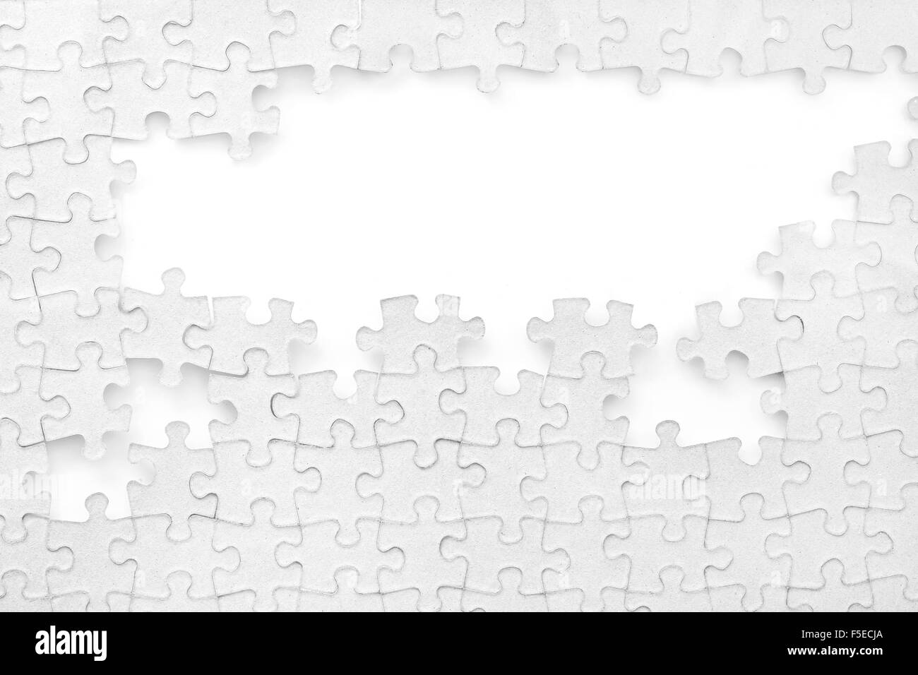 Puzzle incompleto su sfondo bianco Foto Stock