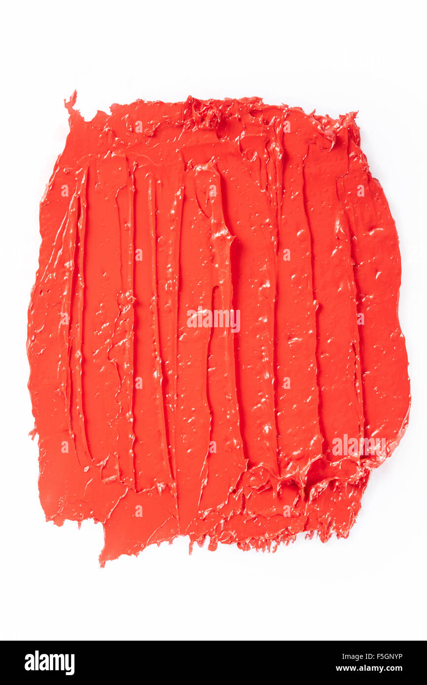 Sbavature del rossetto rosso corsa su bianco Foto Stock