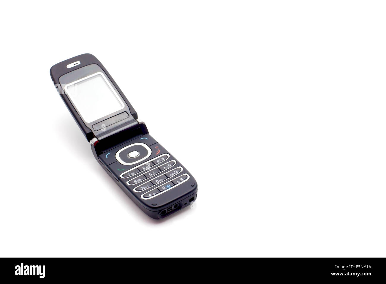 Il vecchio telefono cellulare su sfondo bianco Foto Stock