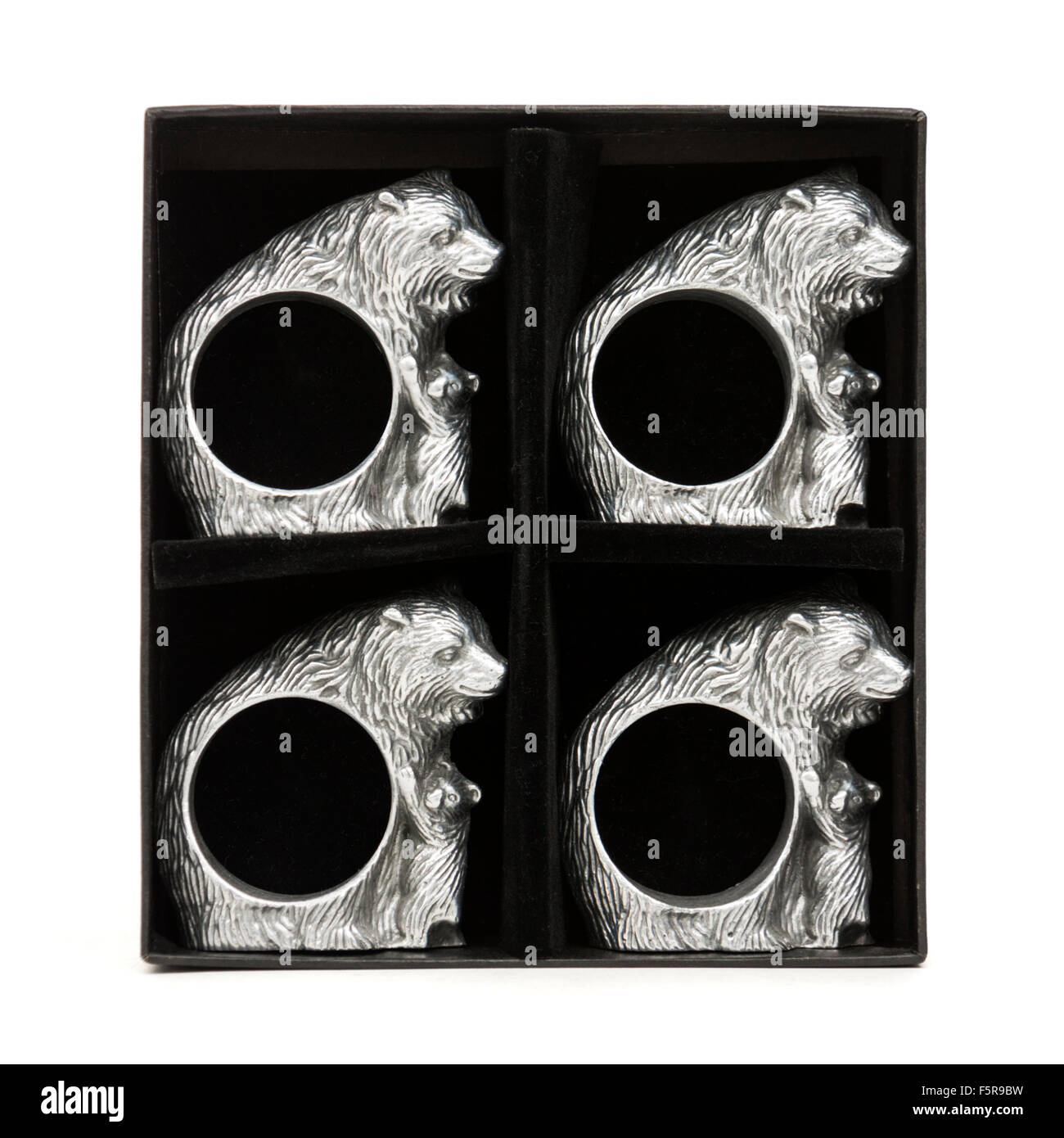 Set di quattro Arthur Corte Cast Aluminium "Orso e lupetti' anelli tovagliolo Foto Stock