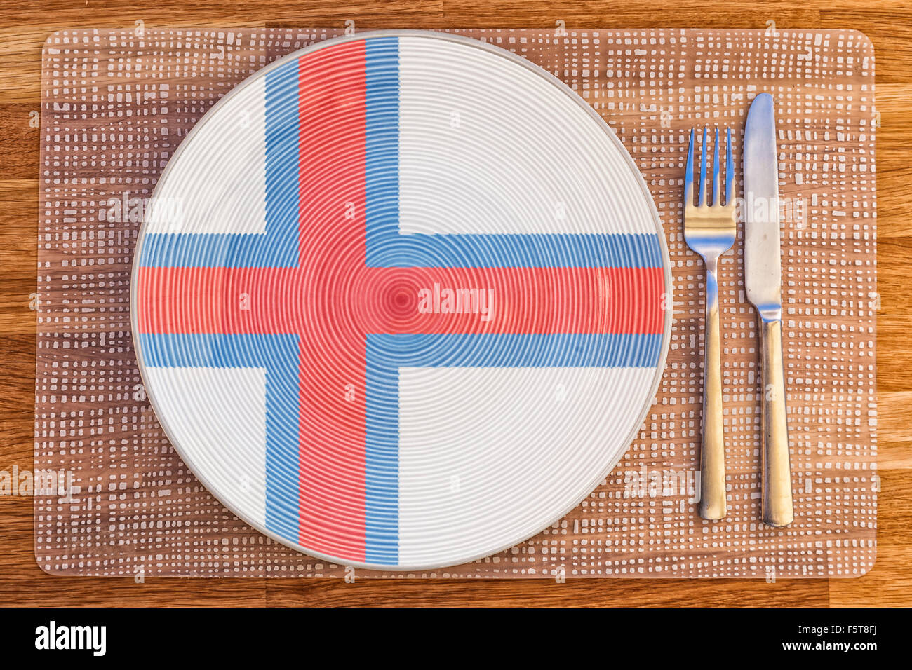 La cena la piastra con la bandiera delle isole Faerøer su di esso per il vostro cibo internazionale e bere i concetti. Foto Stock