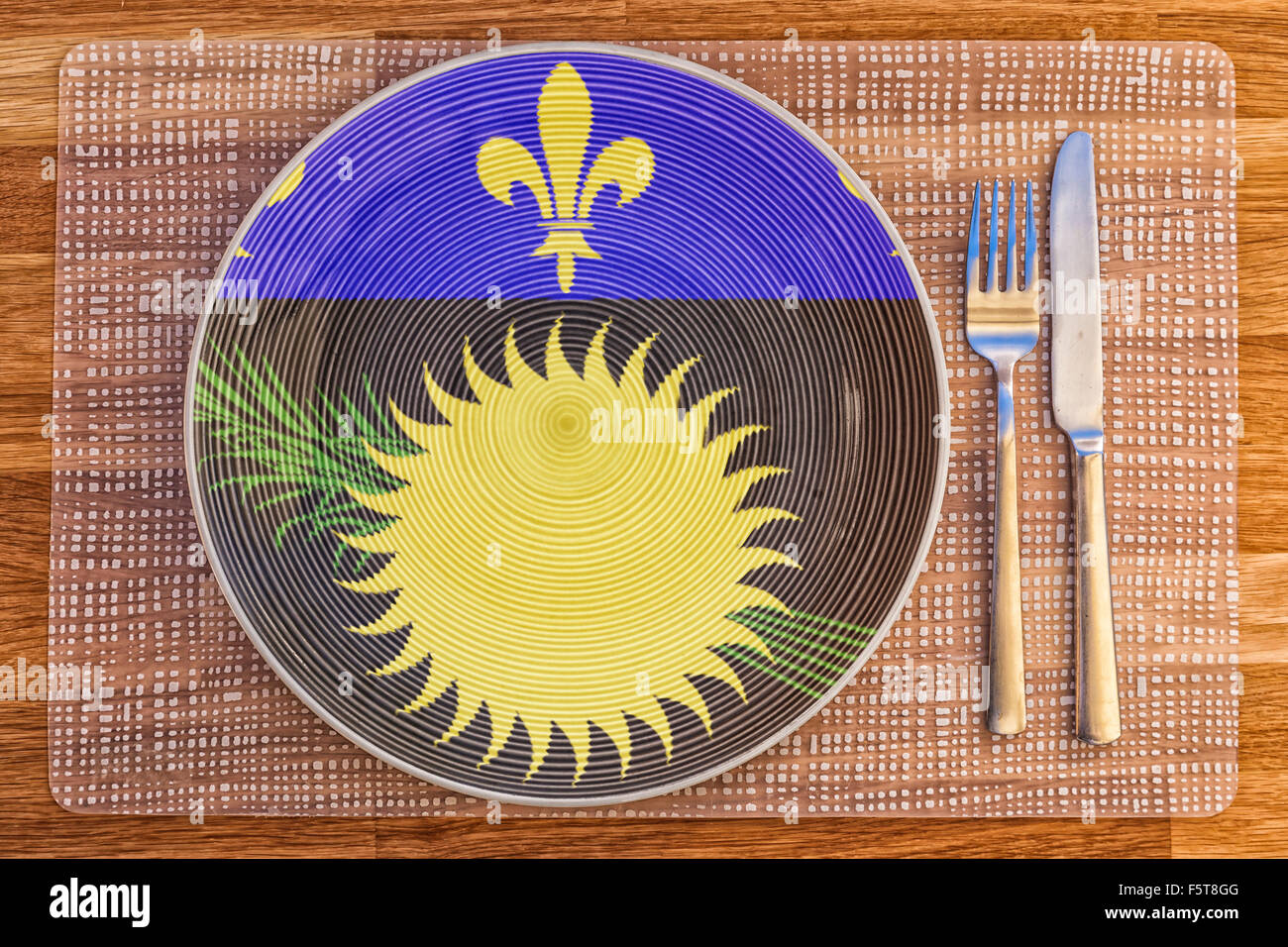 La cena la piastra con la bandiera della Guadalupa su di esso per il vostro cibo internazionale e bere i concetti. Foto Stock