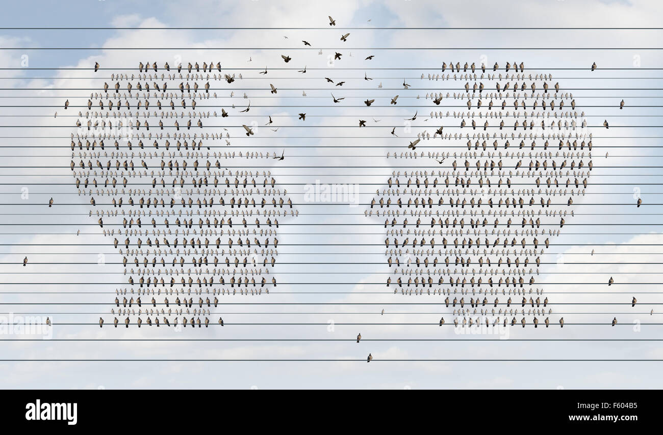 Rete di comunicazione idea e per il collegamento in rete e il lavoro di squadra o di un simbolo di un gruppo di aziende che lavorano insieme come gruppi di uccelli sui cavi elettrici conformato come una testa umana la fusione di unire per il successo. Foto Stock