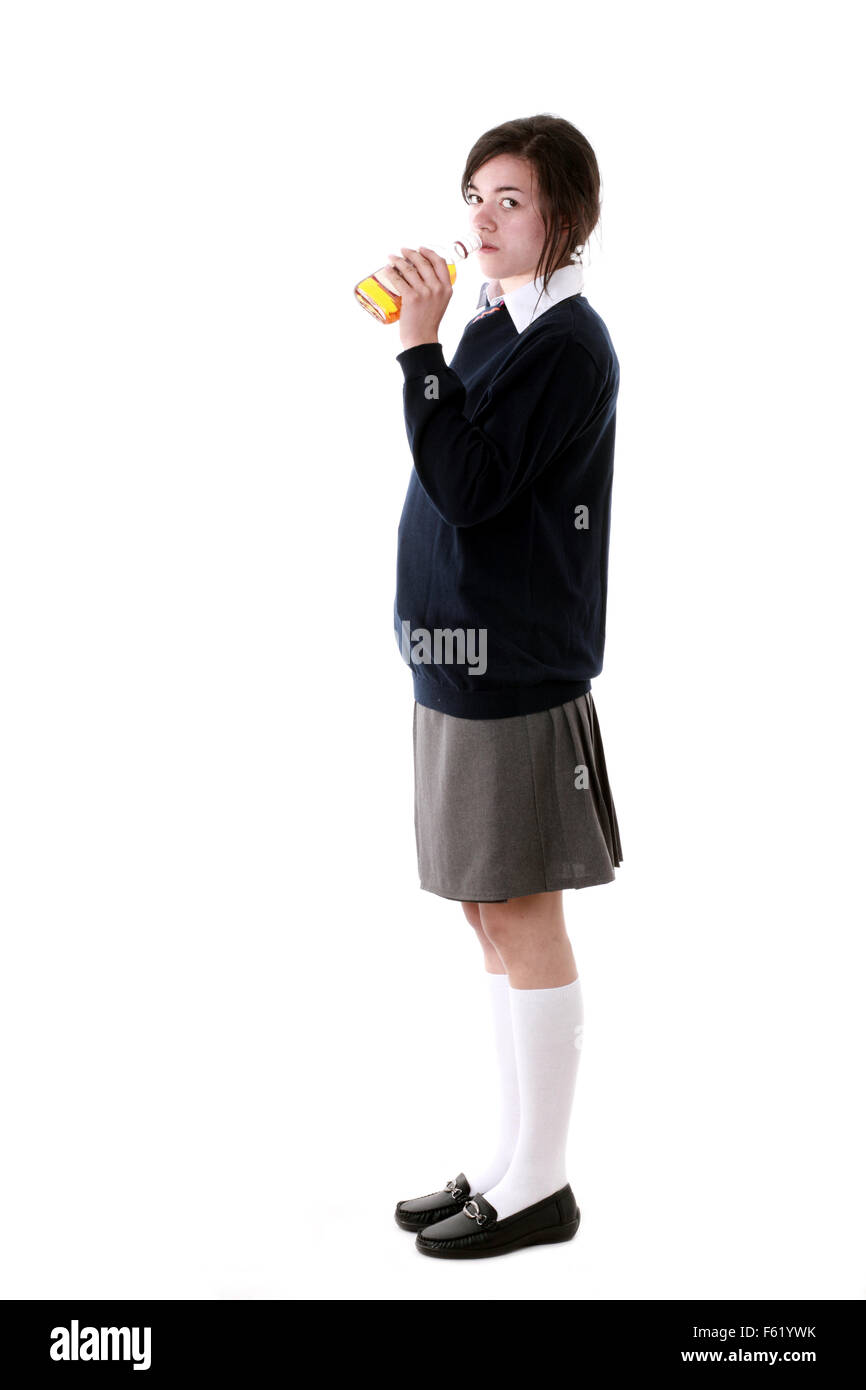 Tagliare isolato razza mista teenage schoolgirl nella sua uniforme scolastica Foto Stock