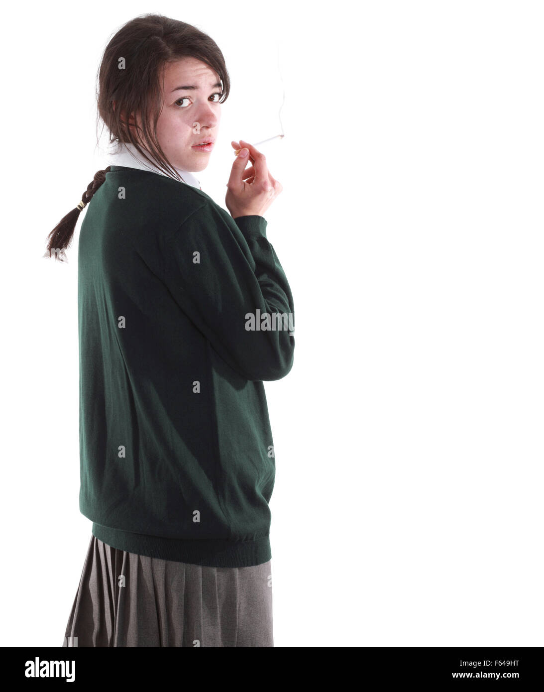 Tagliare isolato razza mista teenage schoolgirl nella sua uniforme scolastica Foto Stock
