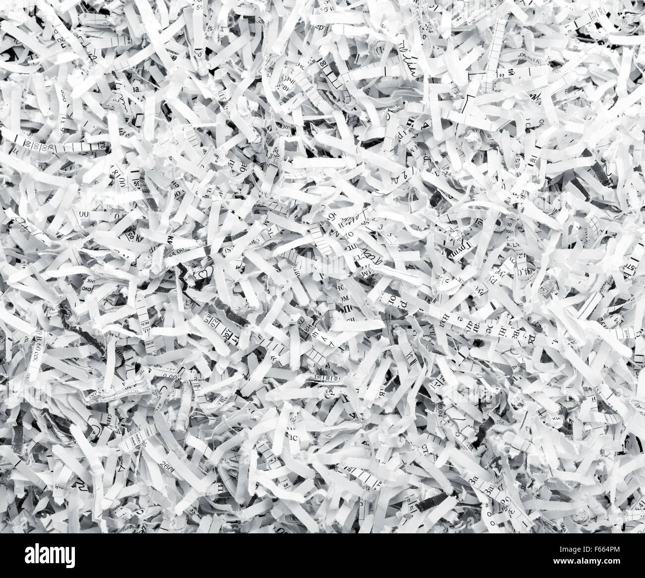 Sullo sfondo di un mucchio di bianco SHREDDED PAPER Foto Stock