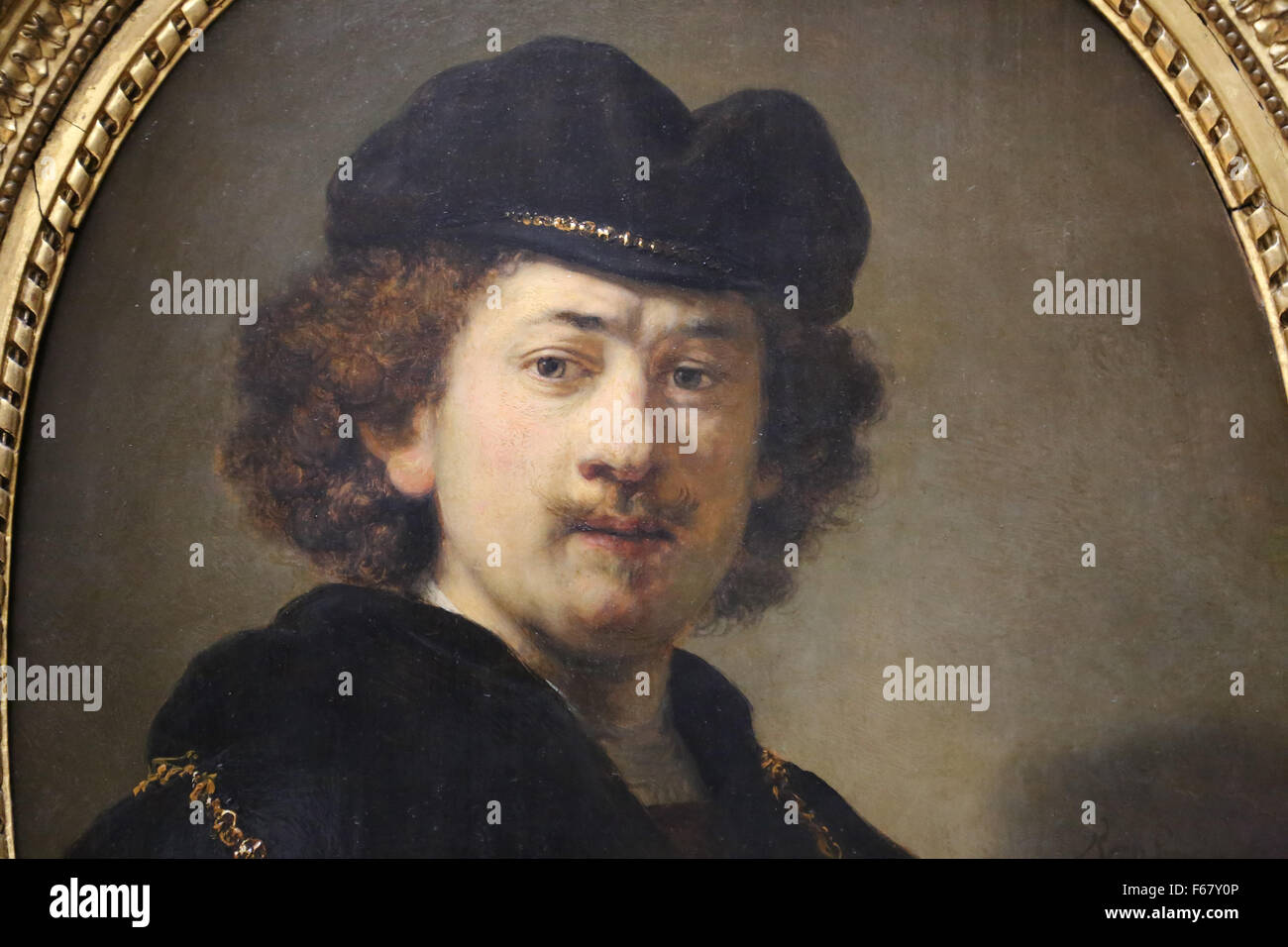 Rembrandt (1606-1669). Pittore olandese. Ritratto di auto che indossa un cappello da cuoco di colore rosso e oro, Ghain olio su pannello. 1633. Il museo del Louvre. Parigi. Foto Stock