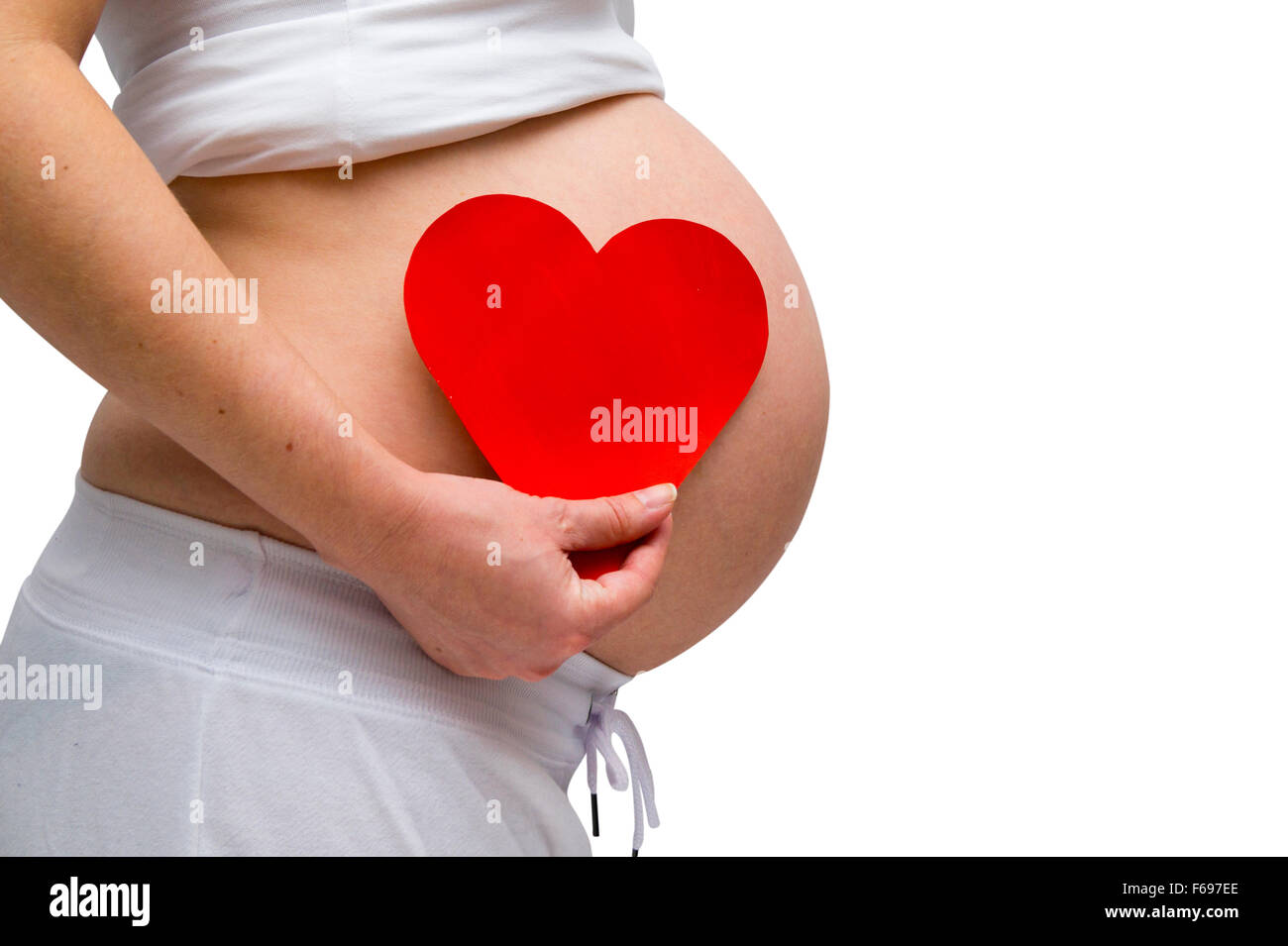 Donne in stato di gravidanza in bianco lounge usura isolato su bianco Foto Stock