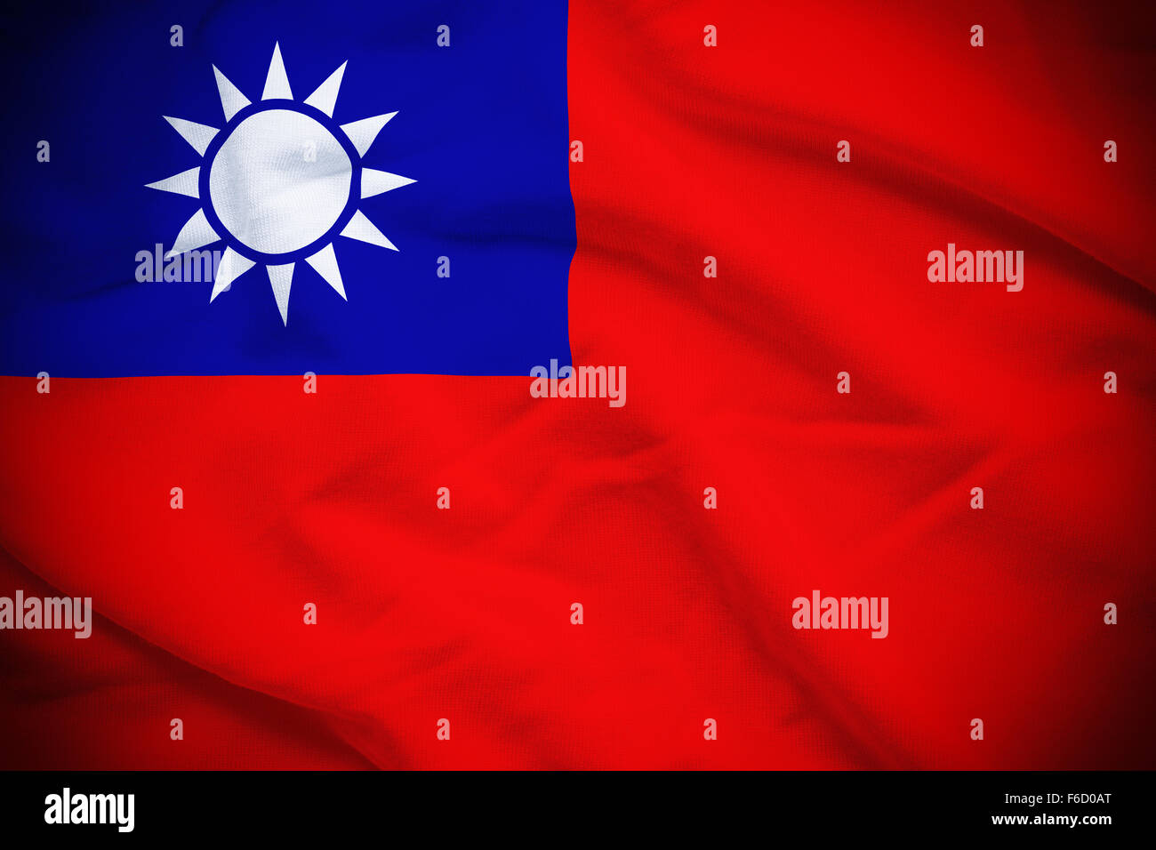 E ondulato increspato bandiera nazionale di Taiwan in background. Foto Stock