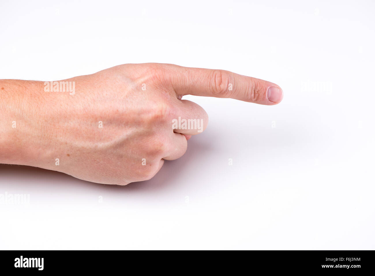 Una mano con un dito poiting su sfondo bianco Foto Stock