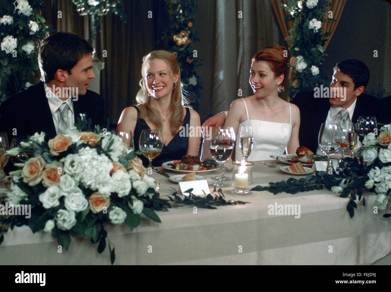 Data di rilascio: 24 luglio 2003. Il titolo del filmato: American Wedding. STUDIO: Universal Studios. Trama: il terzo film in American Pie serie trattative con il matrimonio di Jim e Michelle e raccogliere le loro famiglie e i loro amici, tra cui Jim's vecchi amici di alta scuola e della Michelle sorellina. Nella foto: il Seann William Scott come Steve Stifler, gennaio JONES come Cadence Flaherty, Jason Biggs come Jim Levinstein e Alyson Hannigan come Michelle Flaherty. Foto Stock