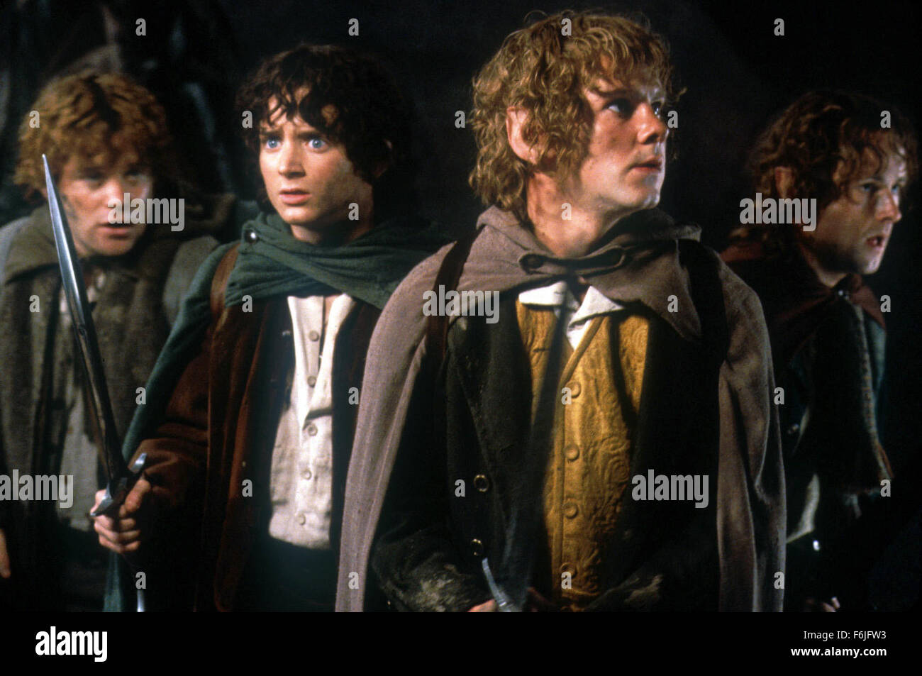 Dic 11, 2003; Hollywood, CA, Stati Uniti d'America; (da sinistra a destra) sean astin come Sam, Elia il legno come Frodo, Dominic Monaghan come allegro e BILLY BOYD come Pippin nella ''Il Signore degli Anelli - Il Ritorno del Re" diretto da Peter Jackson. Foto Stock