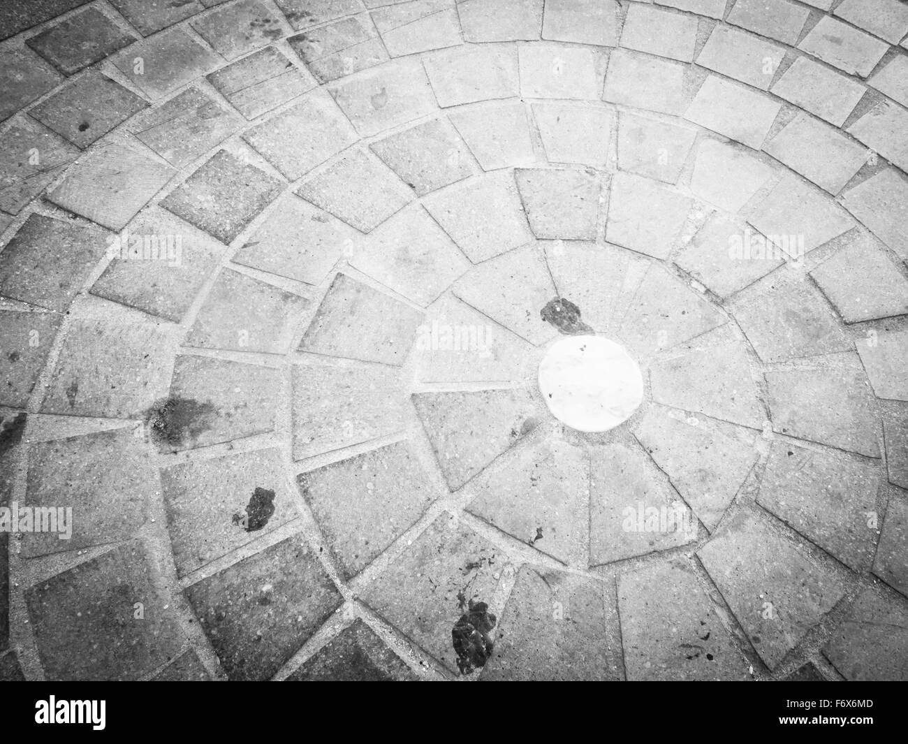 Ciottoli in cerchio. Immagine della pavimentazione urbana sporco Foto Stock