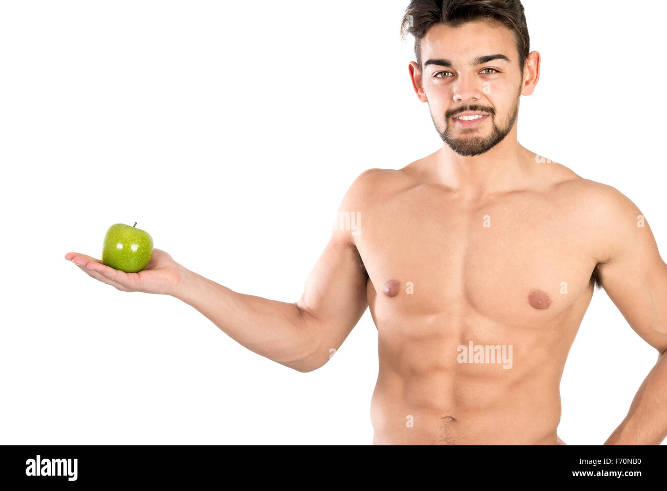 Bello e montare il giovane con un Apple isolato in bianco Foto Stock