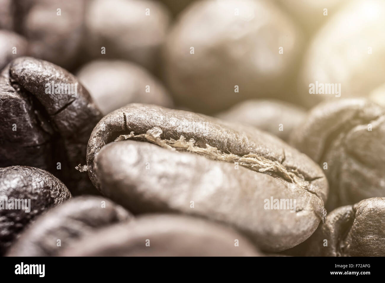 Caffè marrone closeup sfondo. effetto di luce nell'angolo Foto Stock