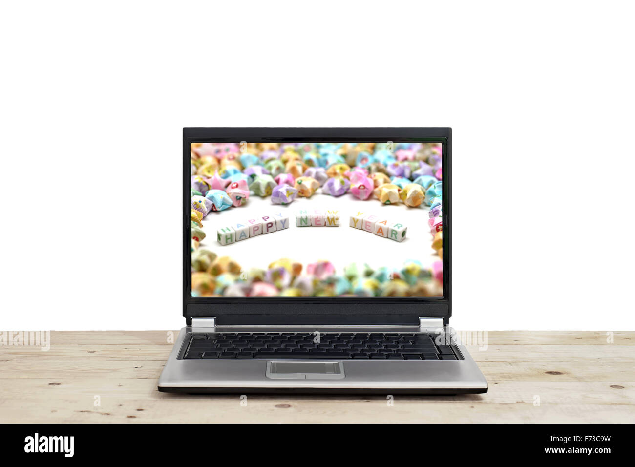 Parola felice anno nuovo su schermo di computer portatile isolato su sfondo bianco Foto Stock