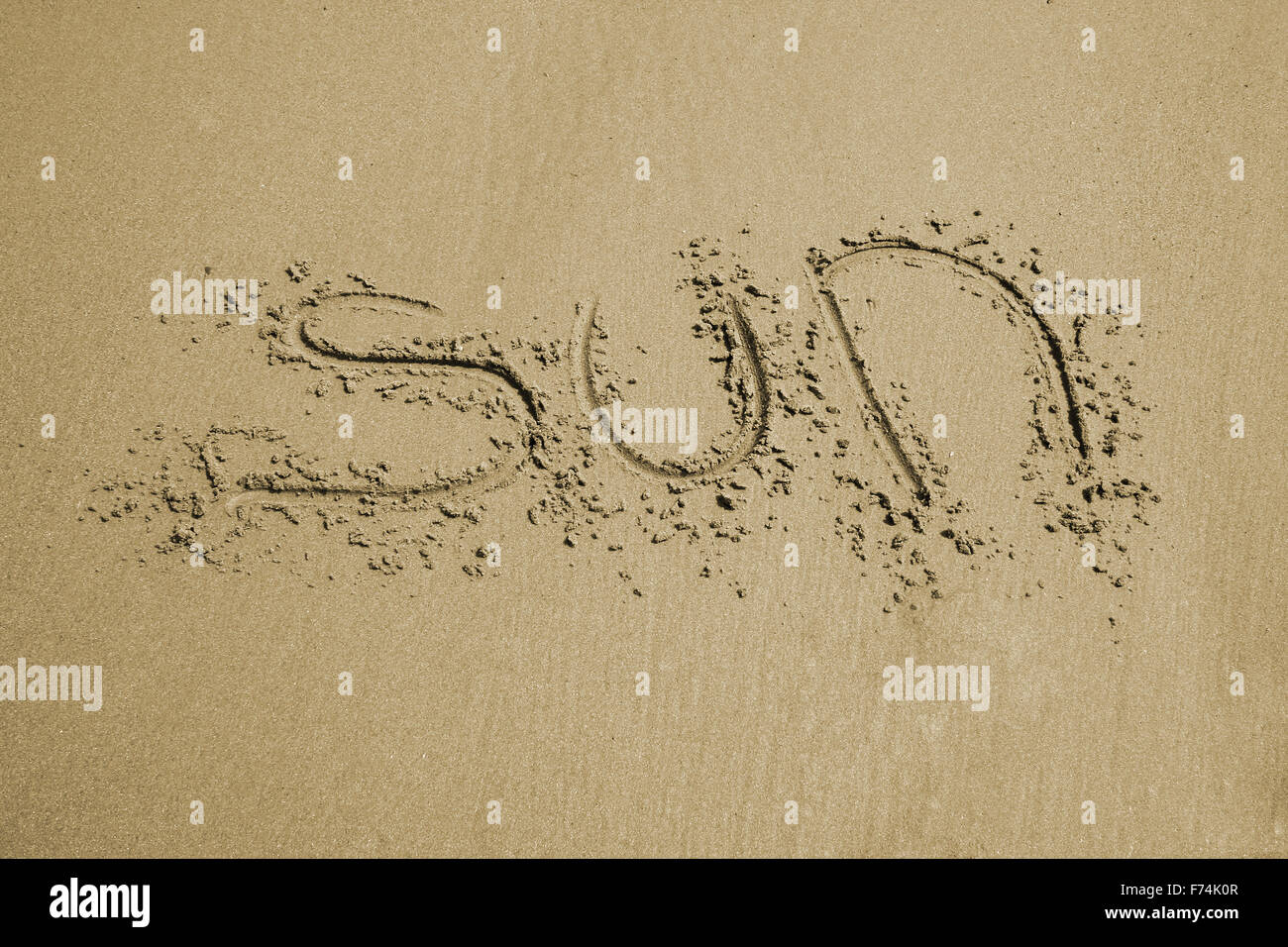 sole nella sabbia Foto Stock