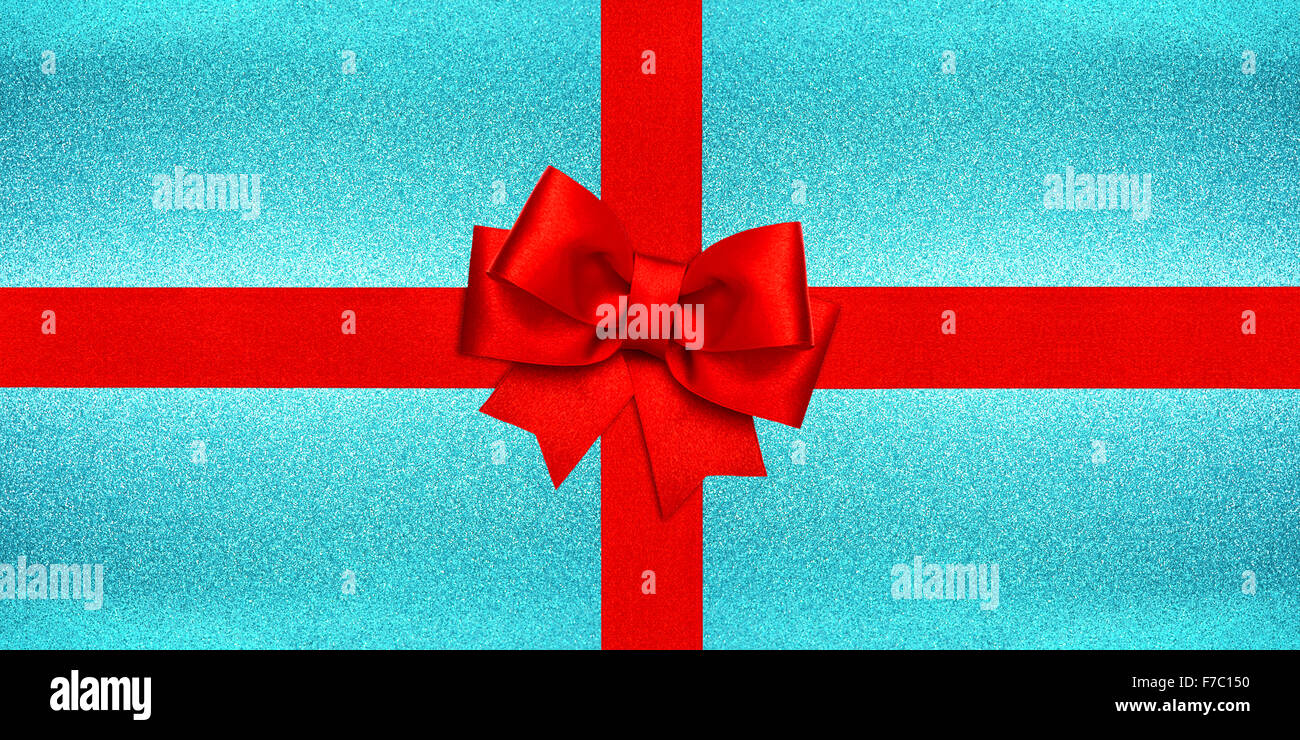 Red Ribbon bow oltre shiny blu ghiaccio texture. Gift card concept. Vacanze a sfondo Foto Stock Red Ribbon bow oltre shiny blu ghiaccio texture. Gift card concept. Vacanze a sfondo Foto Stock