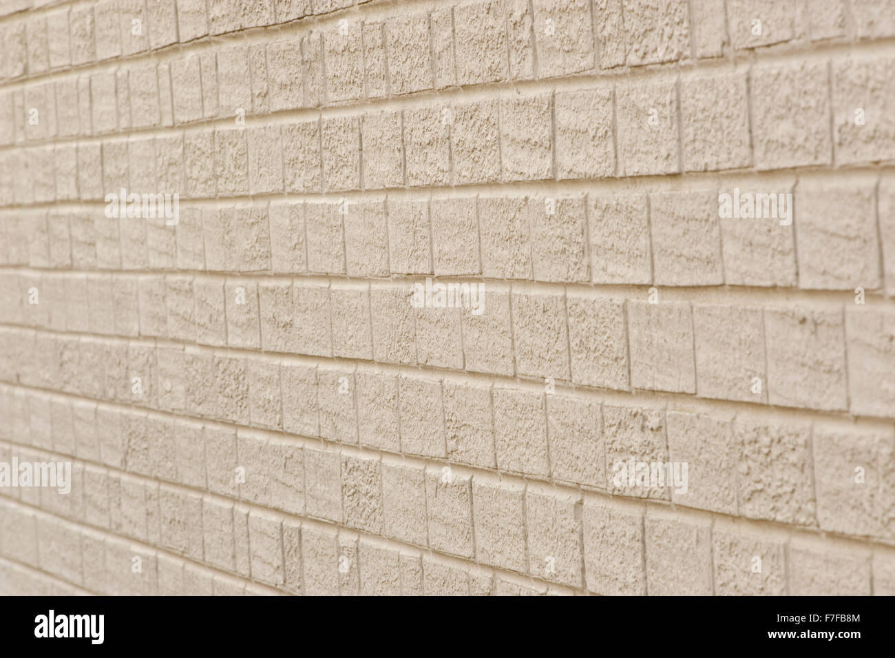 Angolato in mattoni bianchi sullo sfondo di parete Foto Stock
