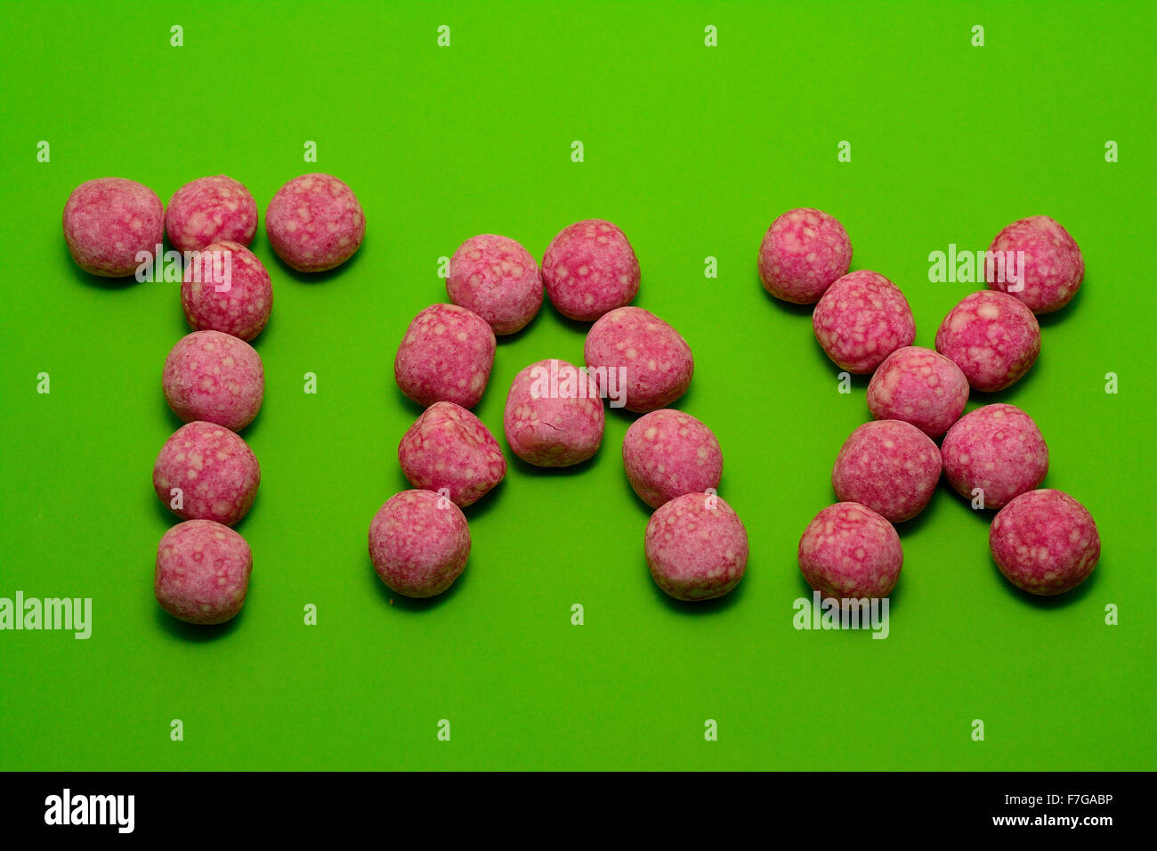 Zucchero concetto fiscale farro con rosa bonbon caramelle Foto Stock