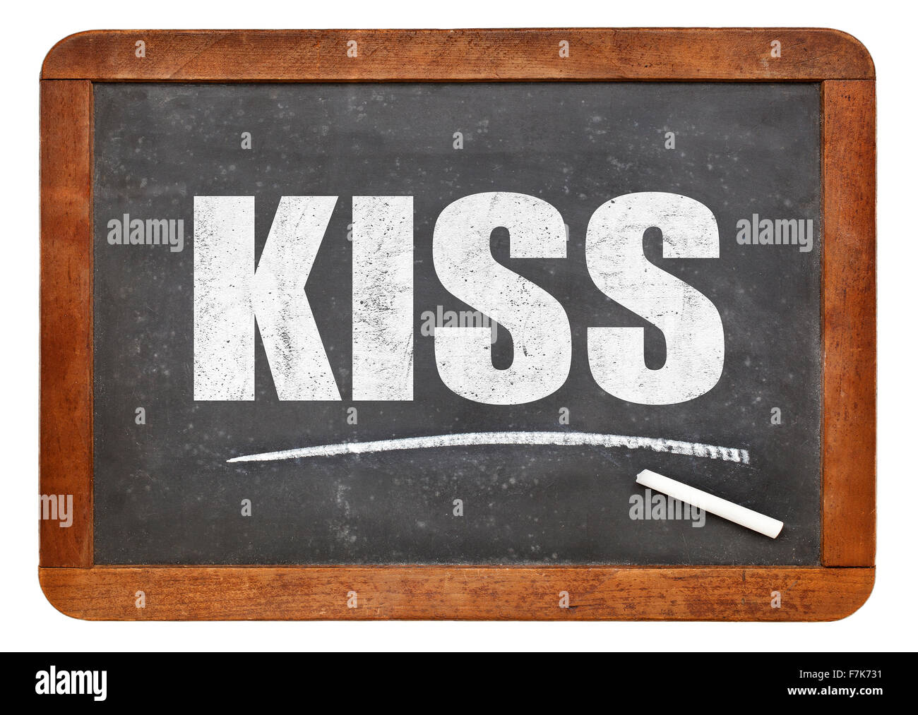 Acronimo di KISS (Keep It Simple Stupid) - bianco gesso di testo su un vintage lavagna ardesia Foto Stock