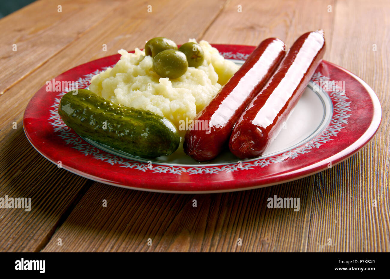 Classic pasto inglese di petardi e mash . Foto Stock