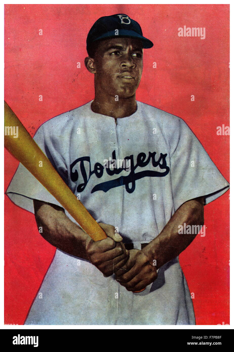 Photomechanical print : mezzitoni, film colore copiare la trasparenza. Retro di copertina di Jackie Robinson fumetto. A mezza lunghezza Ritratto di Jackie Robinson in Brooklyn Dodgers uniforme, poste, tenendo mazza da baseball. Foto Stock