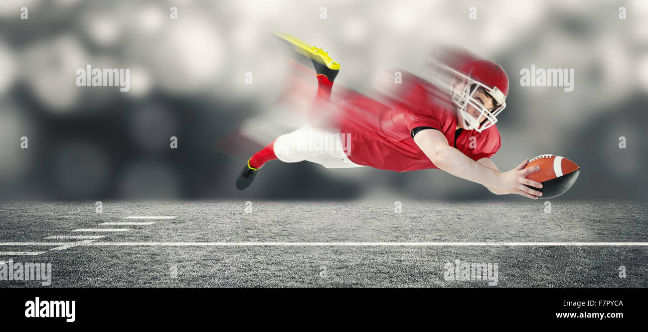 Immagine composita del giocatore di football americano segnando un touchdown Foto Stock