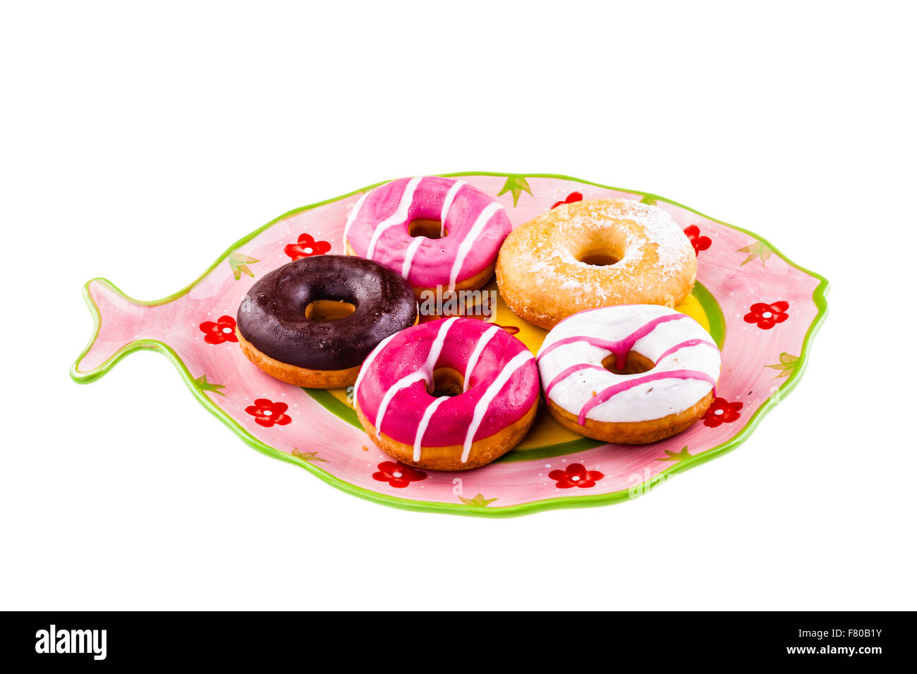 Una collezione di deliziosi e ciambelle colorate su una piastra Foto Stock