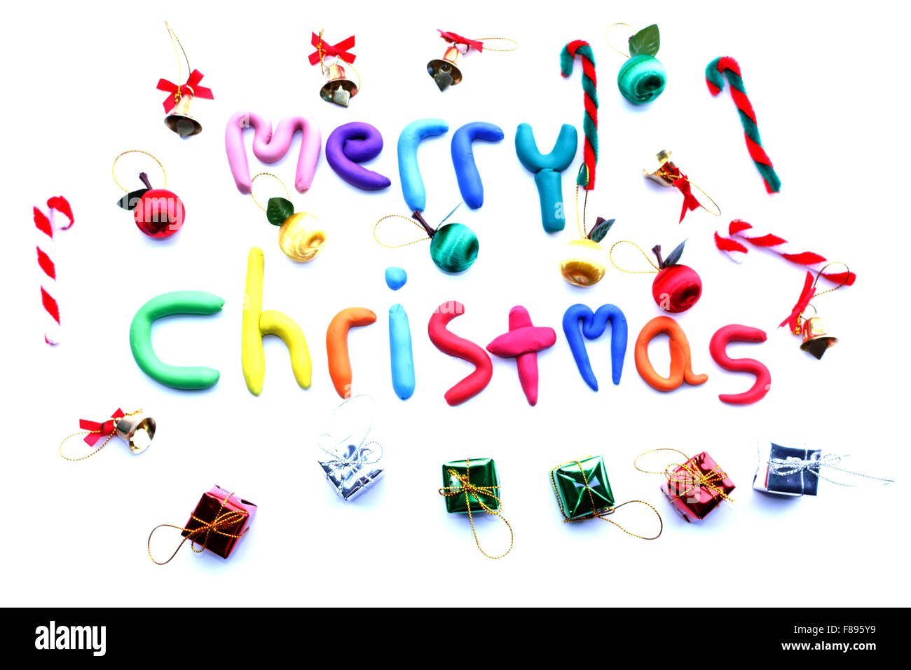 Buon Natale multicolore con confezione regalo su isolato Foto Stock