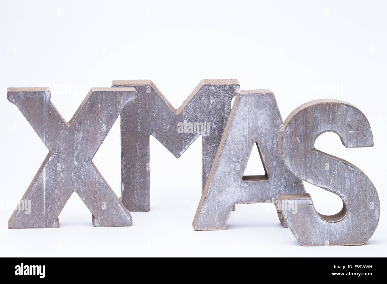 Lettere maiuscole formante la parola x-mas su bianco Foto Stock