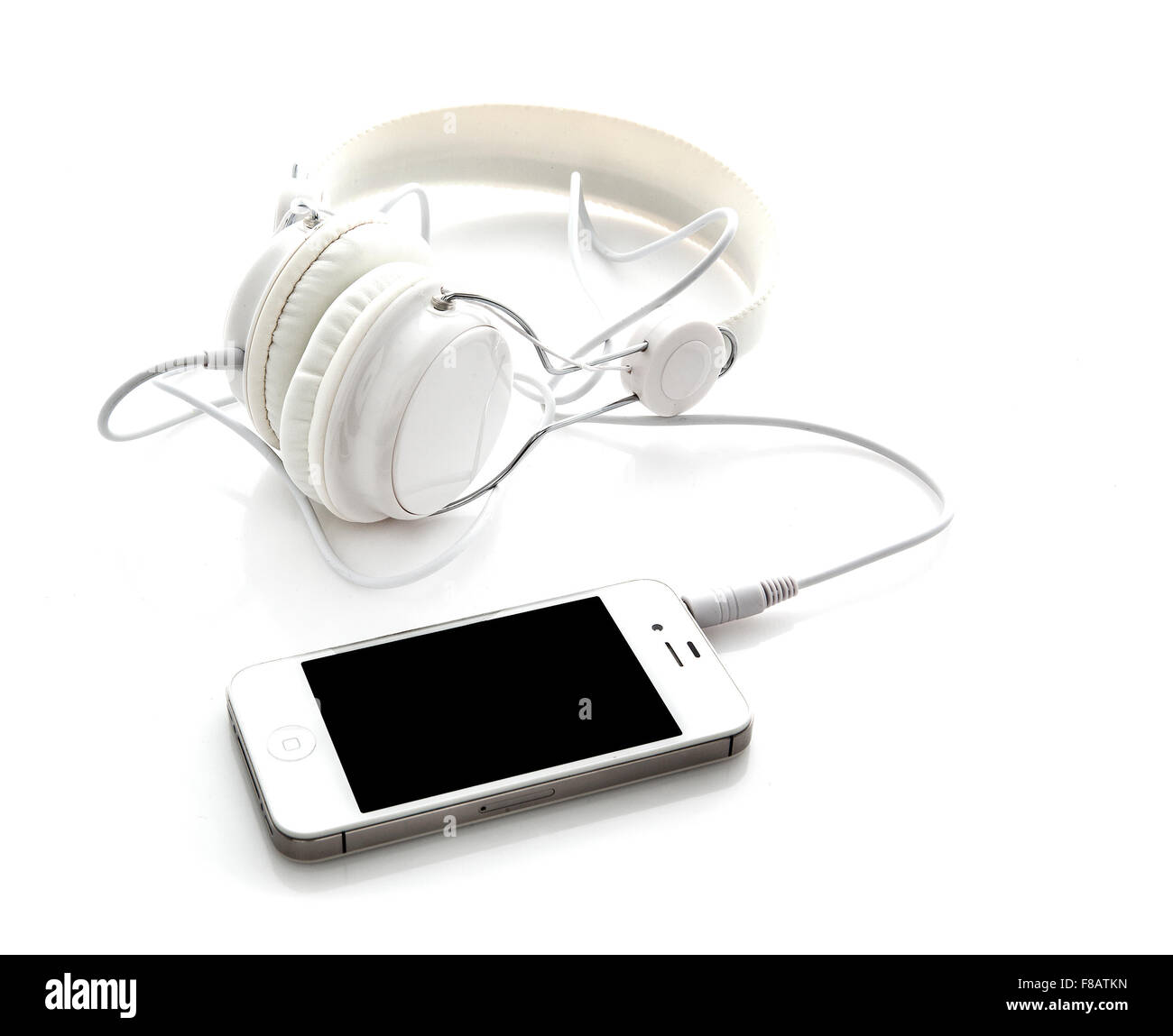 Cuffie bianche con mobile smartphone Foto Stock