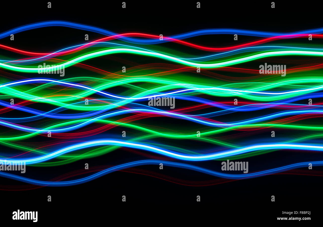 Natale colorate luci LED che scorre ondulate linee blur pattern. Foto Stock