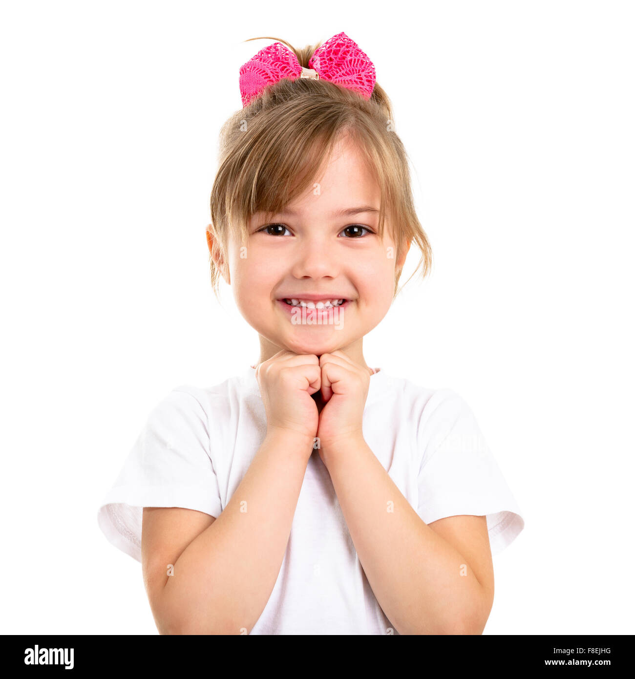 Ritratto di una bella sorridente bambina su sfondo bianco Foto Stock