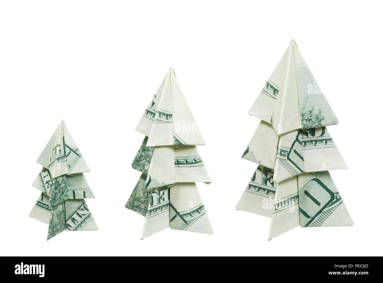 Alberi di Natale fatto di centinaia di fatture del dollaro su sfondo bianco Foto Stock