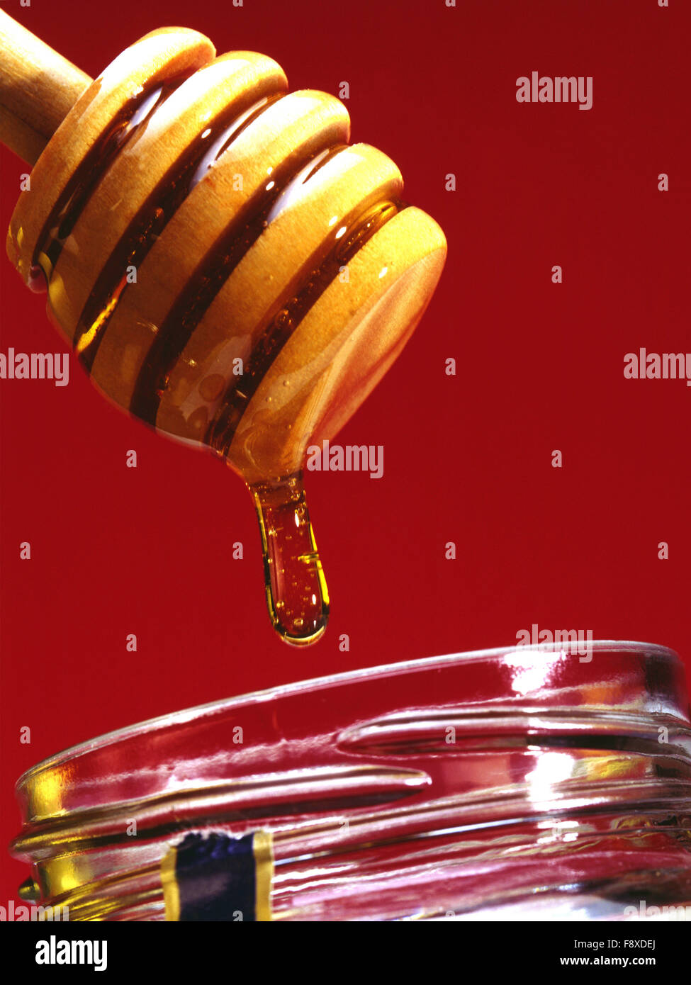 Il miele in caduta dal server Foto Stock