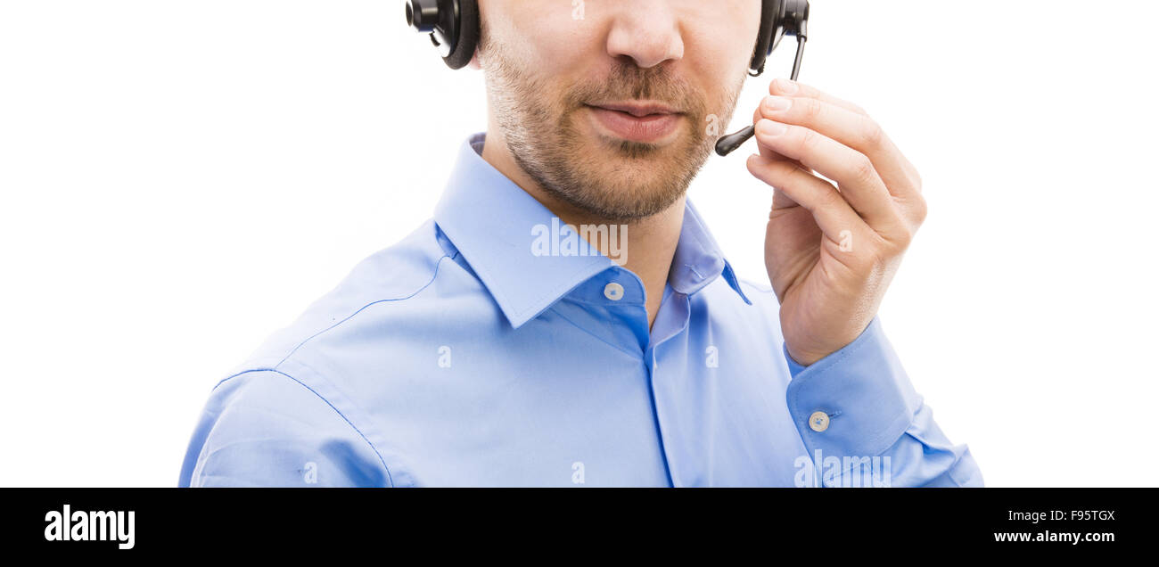 Operatore di call center isolato su bianco. Giovane uomo bello con auricolare. Foto Stock