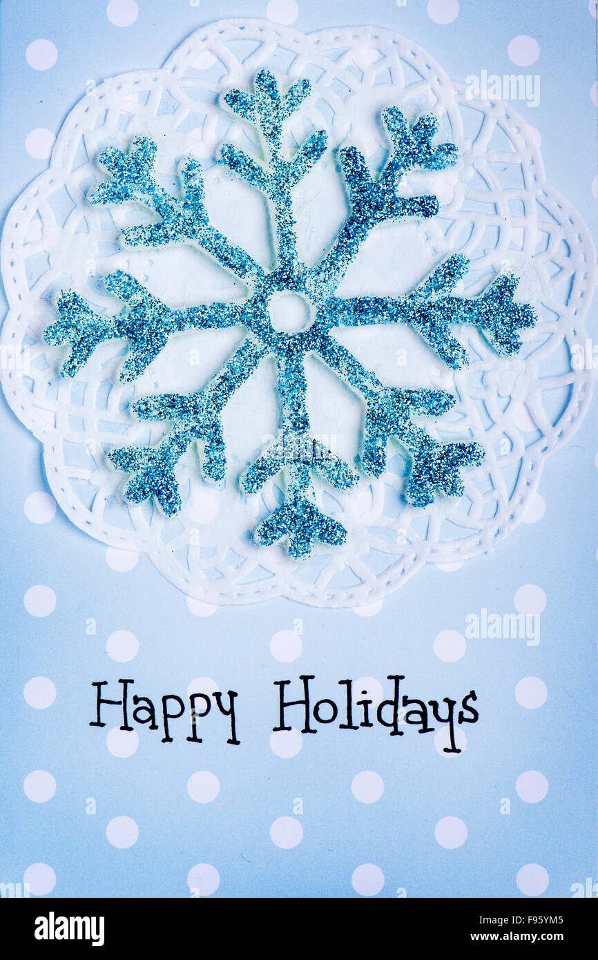 Scheda di Natale con il grande blu il simbolo del fiocco di neve su sfondo puntinato Foto Stock